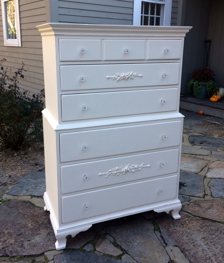 Painted white dresser with rose embellishments